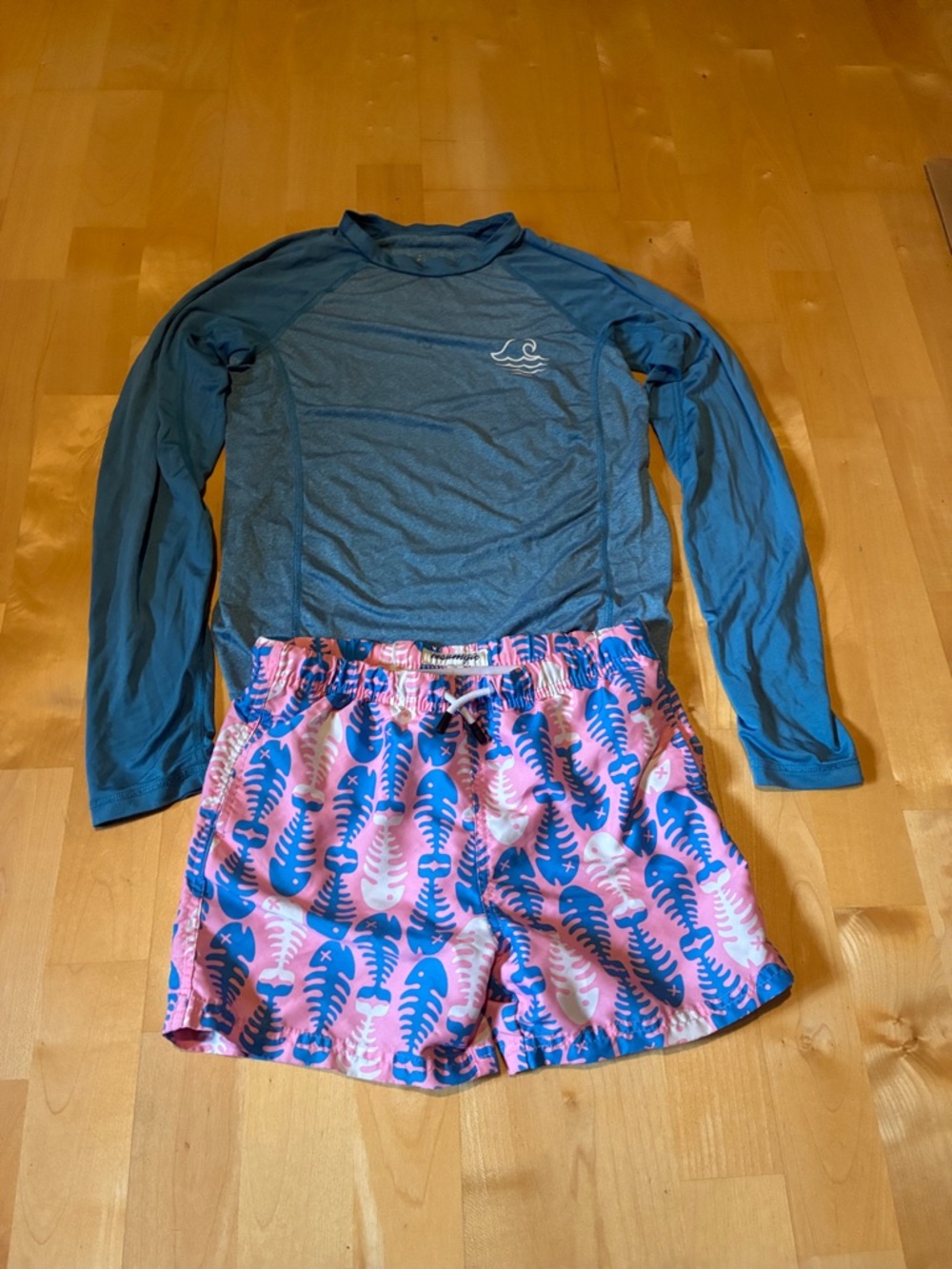 art class Blue swim Top with wave Logo and pink swim suit with fish bones